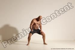 Underwear Gymnastic poses Man Black Muscular Bald Dancing Dynamic poses Academic